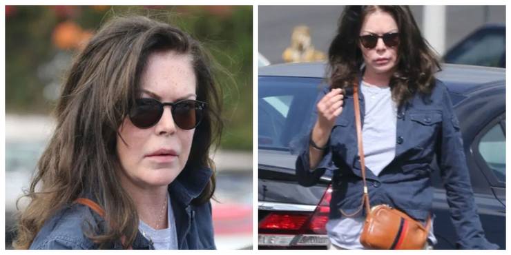 lara flynn boyle plastic surgery wearing jean jacket walking out